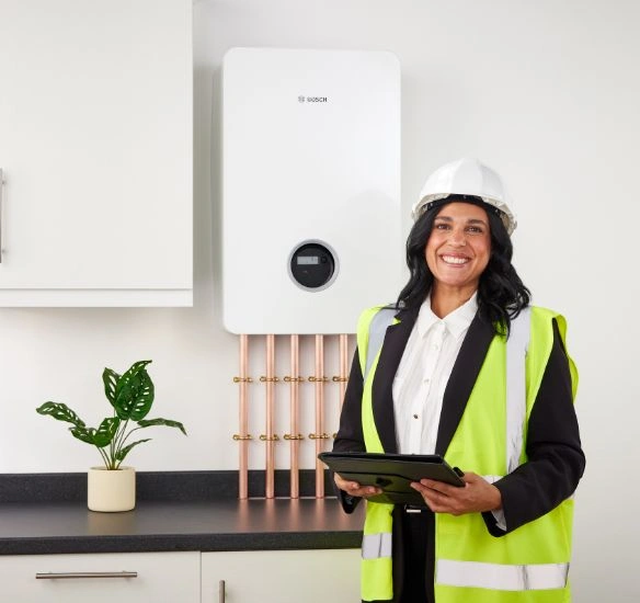 Flow 8500 HIU with a construction worker stood in front